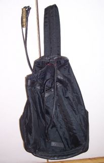 Made of black nylon, this is a roomy bag with a drawstring closure