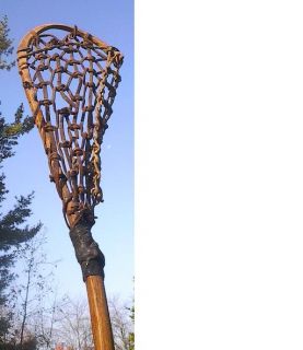 vintage wooden lacrosse stick. Measures 47 long. The lacrosse stick