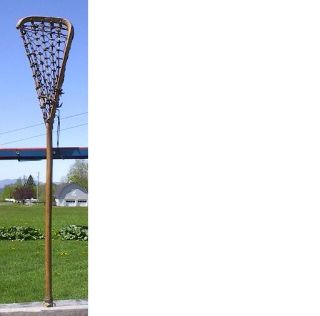 vintage wooden lacrosse stick. Measures 44 long. The lacrosse stick