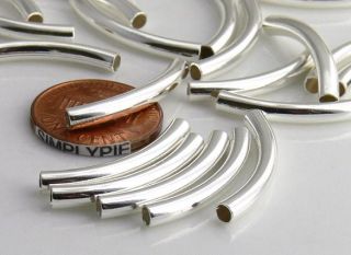 tube metal beads, plated with silver over brass. Use these beads