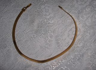 Up for sale is a beautiful vintage gold tone ¼” wide band necklace