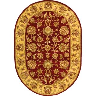 Handmade Heritage Kerman Red/ Gold Wool Rug (76 x 96 Oval