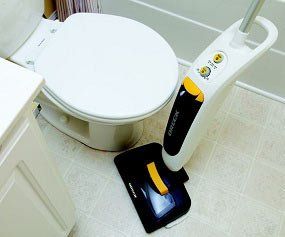 Low profile, swiveling head for cleaning under in tight spaces